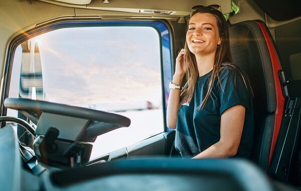 Portrait,Of,Beautiful,Young,Woman,Professional,Truck,Driver,Sitting,In